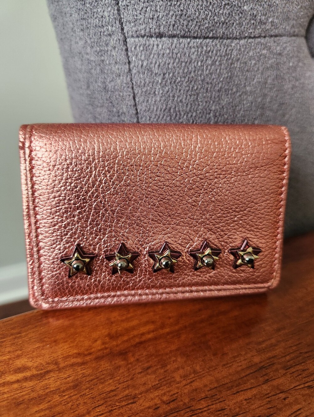 Jimmy Choo Nemo Star Studded Trifold Compact Wallet in a metallic rose gold/pink